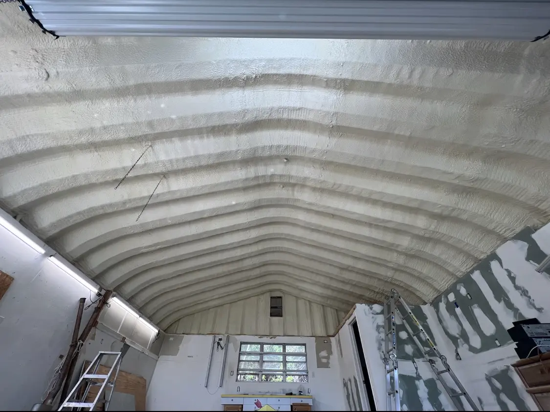 Spray polyurethane foam applied to the underside of a metal roof deck in Chula Vista